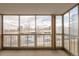 Cozy sun room with large windows providing lots of natural light and neighborhood views at 13606 E Bates Ave # 309, Aurora, CO 80014