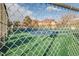 Community tennis court for resident enjoyment and recreation behind a chain link fence at 13606 E Bates Ave # 309, Aurora, CO 80014