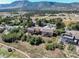 This property offers a beautiful aerial view of the neighborhood and natural setting at 749 Westward Ln, Palmer Lake, CO 80133