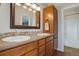 Bathroom featuring a dual sink vanity with a large decorative mirror at 749 Westward Ln, Palmer Lake, CO 80133