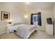 Bedroom with neutral carpet, a small window, and basic furnishings at 749 Westward Ln, Palmer Lake, CO 80133