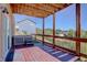 Enjoy outdoor living on this spacious wood deck with a hot tub and scenic views at 749 Westward Ln, Palmer Lake, CO 80133