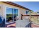 Outdoor deck featuring seating area with table and chairs, and a large sliding glass door at 749 Westward Ln, Palmer Lake, CO 80133