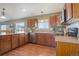 Well-equipped kitchen with wood cabinets, stainless appliances and beautiful countertops at 749 Westward Ln, Palmer Lake, CO 80133