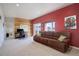 Comfortable living room with rustic wood wall and plush seating at 749 Westward Ln, Palmer Lake, CO 80133