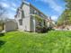 Green backyard featuring a patio, seating, and lush landscaping at 10388 Lions Path, Lone Tree, CO 80124