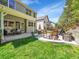 Large backyard with multiple seating areas and well-maintained lawn at 10388 Lions Path, Lone Tree, CO 80124