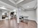 Open basement layout with a ping pong table, bar, and seating area at 10388 Lions Path, Lone Tree, CO 80124
