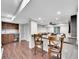Basement bar area with seating, cabinets, and access to the lounge at 10388 Lions Path, Lone Tree, CO 80124