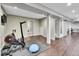 Spacious basement with workout area, wood floors, and recessed lighting at 10388 Lions Path, Lone Tree, CO 80124