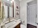 Bathroom featuring granite countertops, modern fixtures, and a neutral color scheme at 10388 Lions Path, Lone Tree, CO 80124
