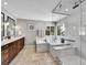 Modern bathroom featuring a glass shower and marble tub surround at 10388 Lions Path, Lone Tree, CO 80124
