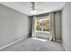 Bright bedroom features neutral decor, carpet, and a ceiling fan at 10388 Lions Path, Lone Tree, CO 80124
