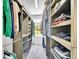 Walk-in closet features custom shelving and ample storage space at 10388 Lions Path, Lone Tree, CO 80124