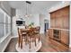 Dining area featuring hardwood floors, pendant lighting, and a built-in cabinet with a wine cooler at 10388 Lions Path, Lone Tree, CO 80124