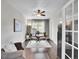 Home office with hardwood floors, a modern desk, neutral decor, and a ceiling fan at 10388 Lions Path, Lone Tree, CO 80124
