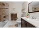 Bathroom featuring a vanity with marble countertop and a tiled shower/tub combo at 12739 W Alabama Pl, Lakewood, CO 80228