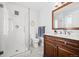 Modern bathroom featuring sleek glass-enclosed shower, vanity with granite countertop, and stylish fixtures at 12739 W Alabama Pl, Lakewood, CO 80228