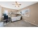 Cozy bedroom with a bunk bed, desk, and a window with natural light at 12739 W Alabama Pl, Lakewood, CO 80228