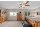 Spacious bedroom with a ceiling fan, light walls, two windows, and ample furniture at 12739 W Alabama Pl, Lakewood, CO 80228