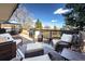 Inviting outdoor deck with comfortable seating and a grill, perfect for entertaining at 12739 W Alabama Pl, Lakewood, CO 80228