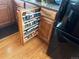 A kitchen cabinet featuring a custom spice rack for optimal organization at 12739 W Alabama Pl, Lakewood, CO 80228