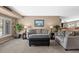 Comfortable living room with neutral tones, plush seating, and ample natural light at 12739 W Alabama Pl, Lakewood, CO 80228