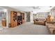 Spacious living area featuring plush carpeting, large windows, and ample space for entertaining at 12739 W Alabama Pl, Lakewood, CO 80228