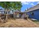 Backyard view of the detached garage and small yard in need of some TLC at 4533 N Pennsylvania St, Denver, CO 80216