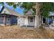 Cozy single-story home featuring a small front porch and natural landscaping at 4533 N Pennsylvania St, Denver, CO 80216