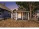 Inviting single-story home with covered front porch, surrounded by mature trees and natural lighting at 4533 N Pennsylvania St, Denver, CO 80216