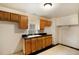 Functional kitchen features ample cabinet space and a clean sink area, ready for your personal touch at 4533 N Pennsylvania St, Denver, CO 80216