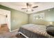 Cozy bedroom with ceiling fan, carpet, and neutral walls at 16259 W 10Th Ave # K1, Golden, CO 80401