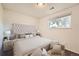 This bedroom features a tufted headboard, soft lighting, and a serene atmosphere at 16259 W 10Th Ave # K1, Golden, CO 80401