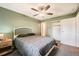 Cozy bedroom with ceiling fan, closet, carpet, and neutral walls at 16259 W 10Th Ave # K1, Golden, CO 80401