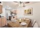 Dining room featuring wood table and seating, neutral walls, and kitchen access at 16259 W 10Th Ave # K1, Golden, CO 80401