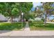 The front of the building is framed by mature trees and features a well-maintained lawn at 16259 W 10Th Ave # K1, Golden, CO 80401