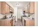 Functional kitchen with light wood cabinets, and standard appliances at 16259 W 10Th Ave # K1, Golden, CO 80401