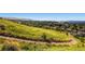This vibrant green landscape offers rolling hills and scenic views, ideal for recreation at 16259 W 10Th Ave # K1, Golden, CO 80401