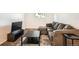 Comfortable living room area featuring neutral walls, plush carpet, and a TV at 16259 W 10Th Ave # K1, Golden, CO 80401