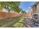 Private backyard offers a serene escape with a grill, seating, and lush greenery at 2417 S Racine Way, Aurora, CO 80014