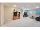 A comfortable finished basement provides additional living space and storage in the home at 2417 S Racine Way, Aurora, CO 80014