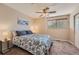 Bedroom with ceiling fan and window featuring blind providing natural light at 2417 S Racine Way, Aurora, CO 80014