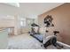 Upper level home gym with treadmill and bike overlooking the front of the house at 2417 S Racine Way, Aurora, CO 80014
