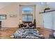 Bright living room with vaulted ceilings, hardwood floors, and stylish decor at 2417 S Racine Way, Aurora, CO 80014