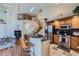 Multi-level living space with a kitchen, stairs to a loft, and a cozy living room with a fireplace at 2417 S Racine Way, Aurora, CO 80014