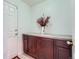 Mud room featuring a built-in cabinet with countertop and a door leading outside at 2417 S Racine Way, Aurora, CO 80014