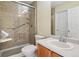 Updated bathroom with walk-in shower and new vanity at 7139 Pine Hills Way, Littleton, CO 80125