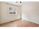 Bright bedroom with hardwood floors and a window offering natural light at 7139 Pine Hills Way, Littleton, CO 80125