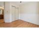 Bedroom with wood flooring and built-in closet at 7139 Pine Hills Way, Littleton, CO 80125